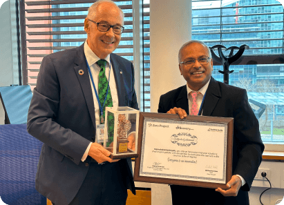 Honoree receiving award and certificate at the Zero Project event